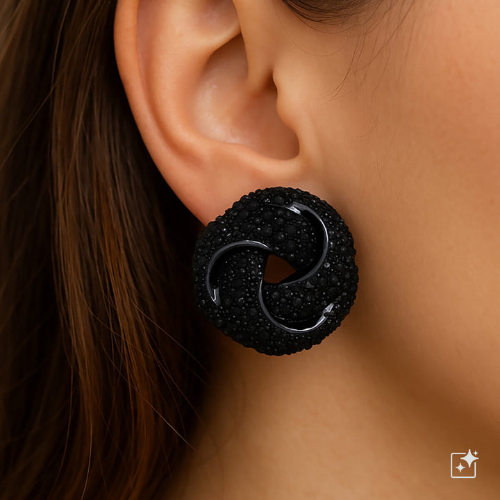 Isot kimaltavat solmu korvakorut