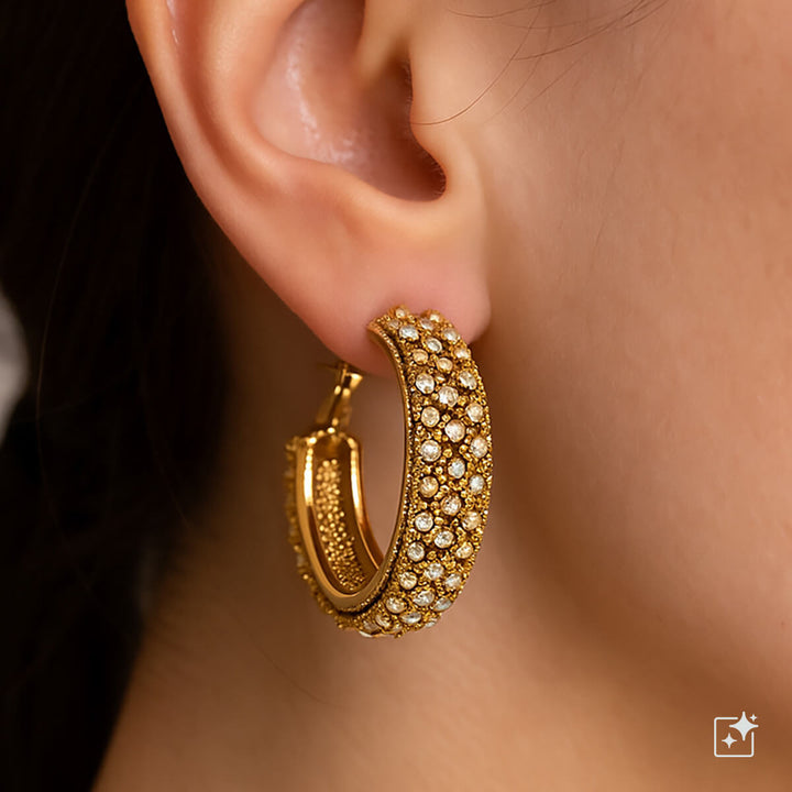 Leveät kimaltavat korvarenkaat