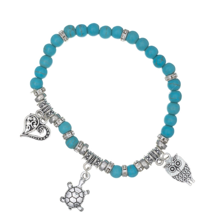 Joustava kivi rannekoru riipuksilla