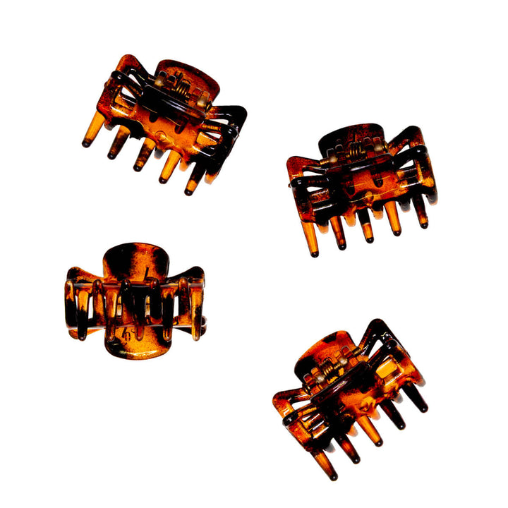 Bred, liten hårklämma i plast i form av en hajtand, 2,6 cm, 4 st