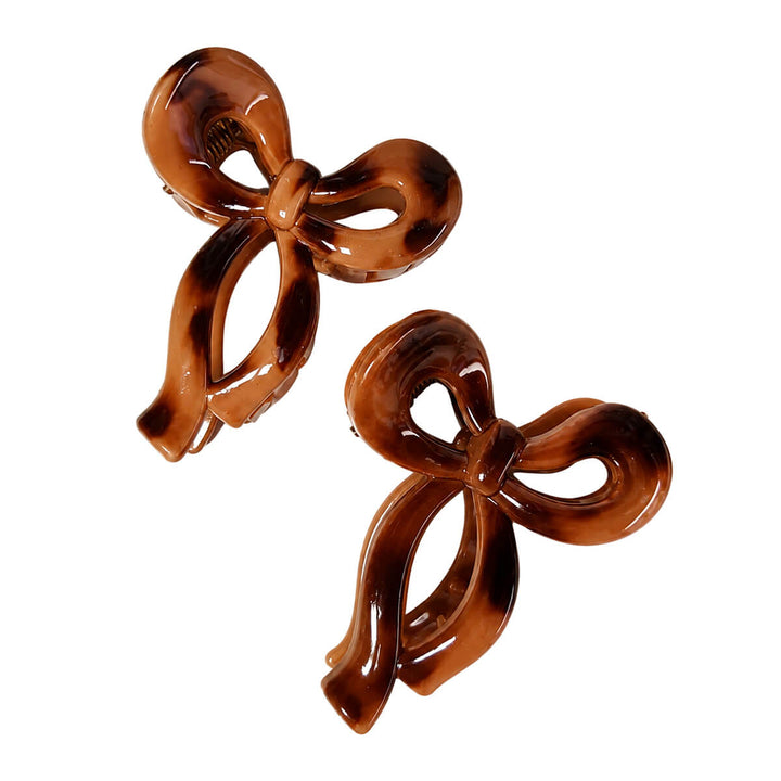 Small plastic bow-tie and shark-tooth hair clips, set of 2