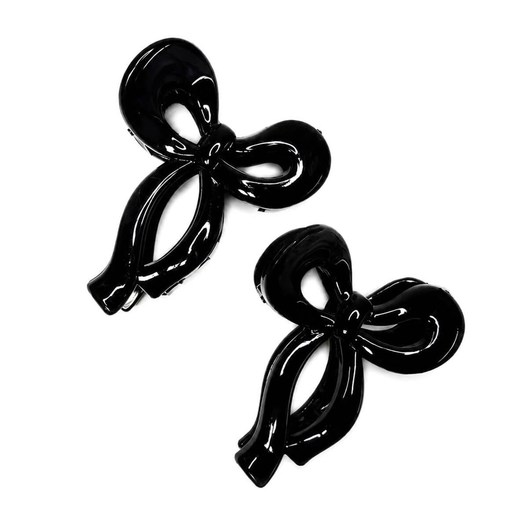 Small plastic bow-tie and shark-tooth hair clips, set of 2